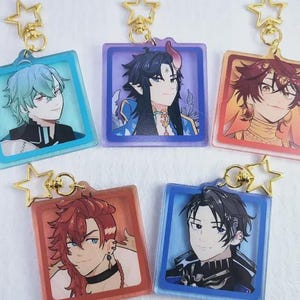 May include: Five square acrylic keychains featuring anime-style character portraits. Each keychain has a gold star-shaped clasp. The portraits have different hair colors and outfits, set within colored frames of blue, purple, and orange.