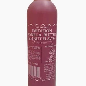 May include: A maroon-colored bottle with a white cap, labeled "THE ORIGINAL IMITATION VANILLA, BUTTER and NUT FLAVOR." The bottle contains 237 ml of liquid and is designed for all-purpose use in baking cakes and other desserts.