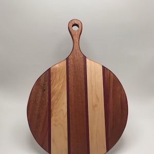 Handmade round mahogany, maple, and purpleheart cutting board with handle, serving board, cheeseboard, charcuterie board