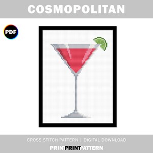 May include: A cross stitch pattern of a red Cosmopolitan cocktail in a martini glass with a lime wedge garnish. The pattern is in a black frame and labeled "COSMOPOLITAN" at the top and "CROSS STITCH PATTERN | DIGITAL DOWNLOAD" at the bottom.