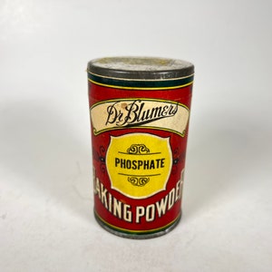 May include: A vintage red and yellow tin can of Dr. Blumers Phosphate Baking Powder.