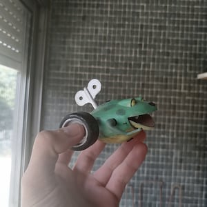 Toy story sid toy wind up frog