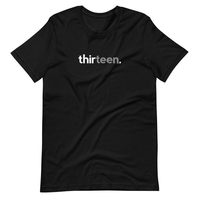 May include: Black t-shirt with the word "thirteen." printed in white on the front.
