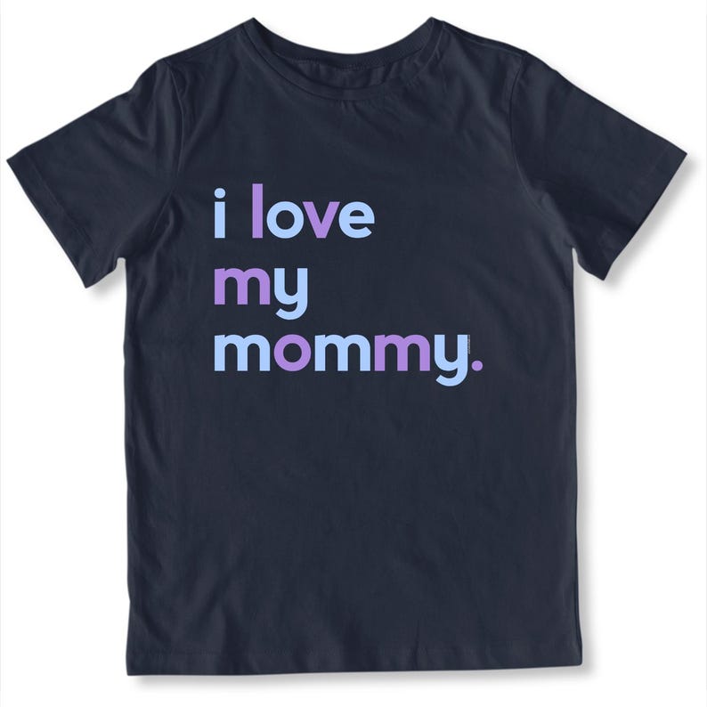 May include: Navy blue t-shirt with the text "i love my mommy" in light blue, purple, and light purple. The shirt is a crew neck and appears to be made of cotton.