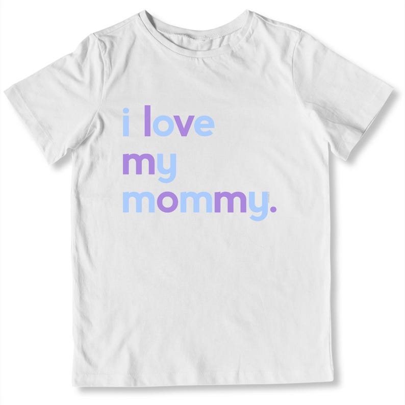 May include: White t-shirt with the phrase "i love my mommy" printed in light blue and purple. The shirt is a short-sleeved crew neck style, perfect for casual wear.