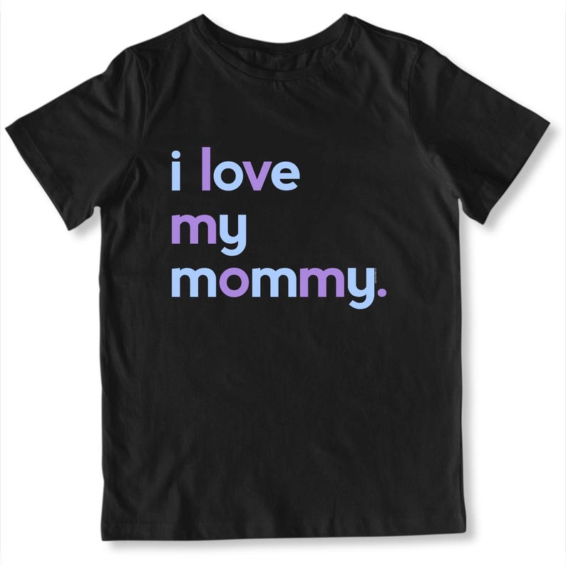 May include: Black t-shirt with the phrase "i love my mommy" in light blue and purple lettering. The shirt is a crew neck style and appears to be made of a soft material. The text is centered on the front of the shirt.