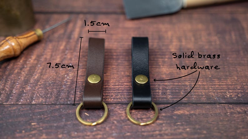 Slim Italian leather loop keyrings/keychains in dark brown and black side by side with solid brass split ring and rivet. Measurements 7.5cm by 1.5cm wide