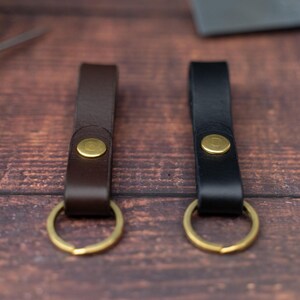 Dark brown and black keyrings side by side