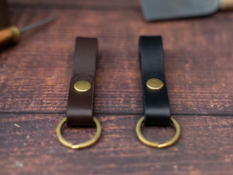 Dark brown and black keyrings side by side