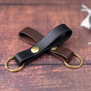 Black keyring over a dark brown keyring