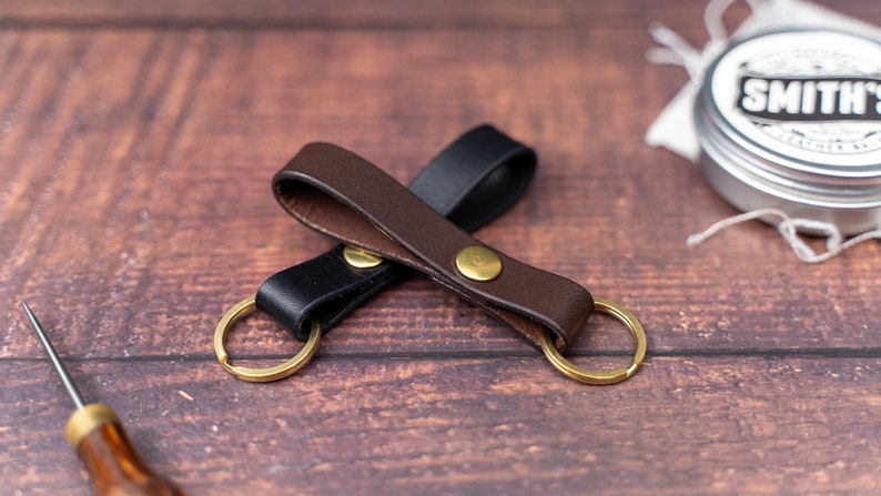 Dark brown keyring over a black keyring