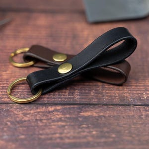 Black keyring over a dark brown keyring