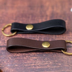 Dark brown and black keyrings side by side