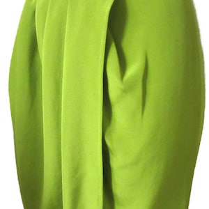 May include: Lime green high-waisted pants with a draped front panel. The pants have a wide waistband and a tailored fit. The fabric appears to be a smooth, solid color. The pants are suitable for formal or semi-formal occasions.