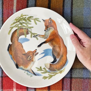 vintage “ Foxes and Evergreen ” 1977 Limited Edition Christmas Plate Canadian Edition Edward J Bierly artist. Halbert’s Inc.