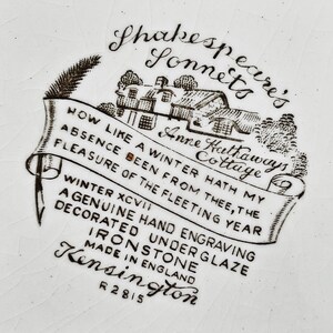 May include: Black and white illustration of a cottage with the text "Anne Hathaways Cottage" and "Shakespeare's Sonnets" on a white background. The text below the image reads "How like a winter hath my absence been from thee, the pleasure of the fleeting year. Winter XCVI. A genuine hand engraving decorated under glaze ironstone. Made in England. Kensington R2815."