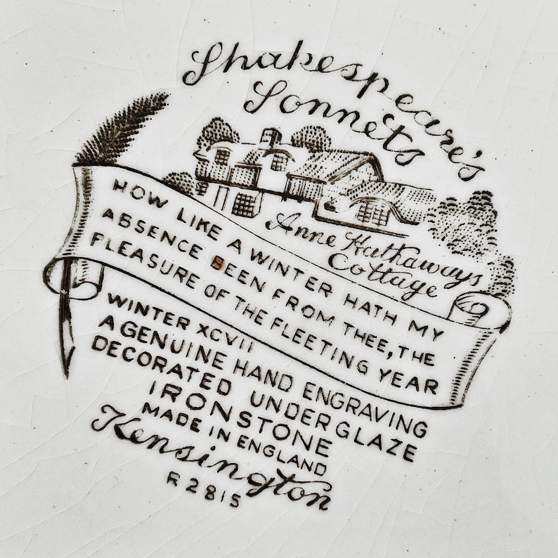 May include: Black and white illustration of a cottage with the text "Anne Hathaways Cottage" and "Shakespeare's Sonnets" on a white background. The text below the image reads "How like a winter hath my absence been from thee, the pleasure of the fleeting year. Winter XCVI. A genuine hand engraving decorated under glaze ironstone. Made in England. Kensington R2815."
