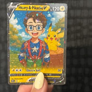 May include: A holographic trading card featuring "Henry & Pikachu V." The card depicts a boy with glasses and Pikachu. The card has a blue, red, and yellow color scheme, with the text "Electro ball" and the number "30."