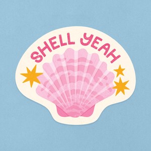 May include: A pink seashell with the text "SHELL YEAH" in pink letters and two yellow stars on a white background.