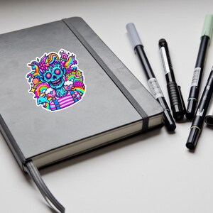 May include: A sticker featuring a blue and pink cartoon character with a skull head and a rainbow background. The character is wearing a pink and white striped shirt and blue overalls.