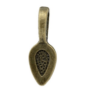 May include: A bronze-colored metal pendant bail with a teardrop-shaped opening. The bail has a loop at the top for attaching a chain or cord.