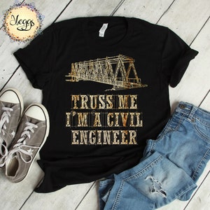 May include: Black t-shirt with a blueprint of a truss bridge and the text "TRUSS ME I'M A CIVIL ENGINEER" printed on it.