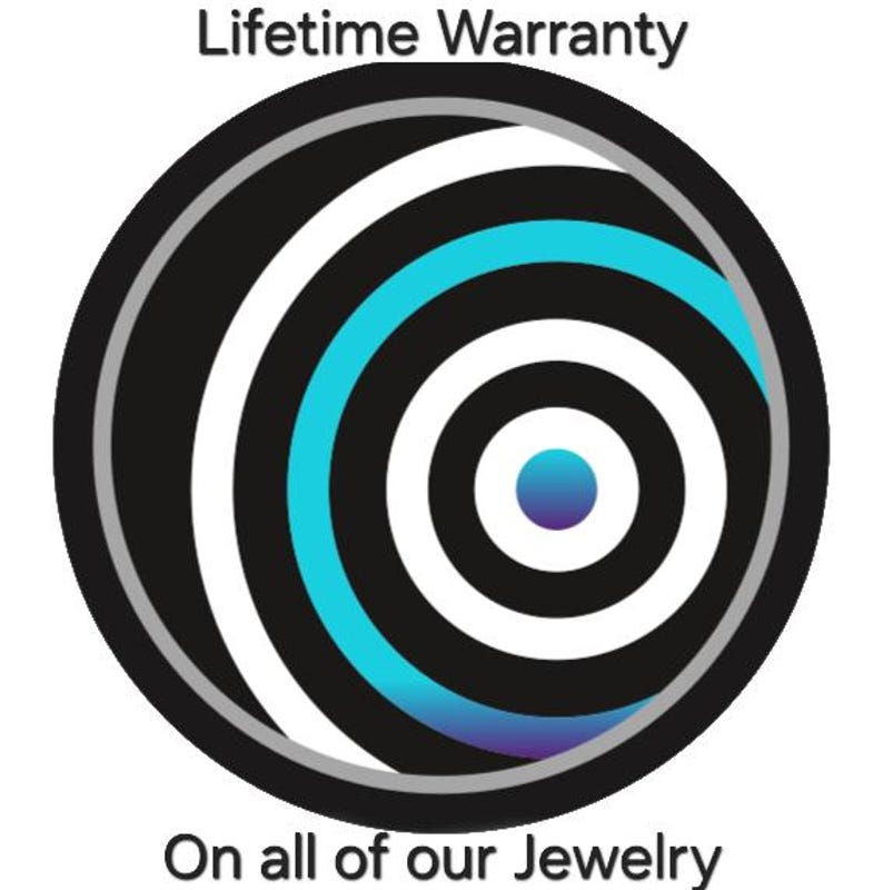 May include: A circular graphic featuring concentric rings in black, white, and cyan blue. The center is a solid blue dot. The text "Lifetime Warranty" appears above the circle, and "On all of our Jewelry" is printed below the graphic.