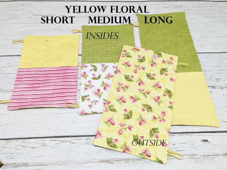 May include: Three yellow floral fabric pouches with pink and white stripes, a floral print, and a yellow polka dot print. The pouches are labelled "Short", "Medium", and "Long". The pouches are labelled "Insides" and "Outside".