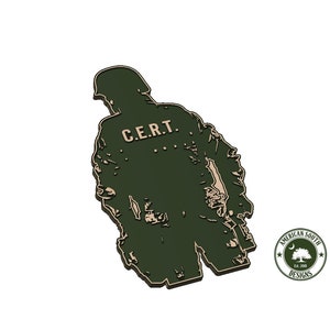 May include: A green silhouette of a person wearing a uniform with the text "C.E.R.T." on the back. The silhouette is in a 3D style and has a textured surface. The image is from American South Designs.
