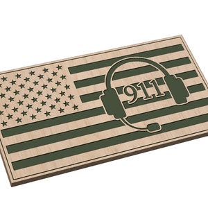 May include: A wooden American flag with a green 911 headset design. The flag is made of wood and has a distressed look.