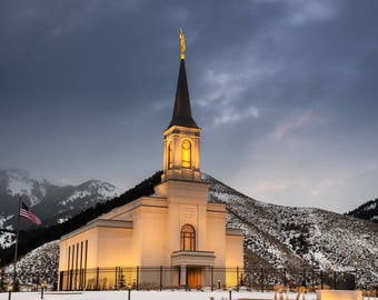 Star Valley Wyoming Temple as the sun rises in Winter