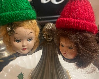 Creepy Christmas doll heads on candle holder 6” tall