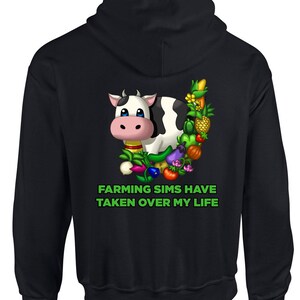 May include: Black hoodie with a cartoon cow surrounded by various farm crops and the text "Farming Sims Have Taken Over My Life" in green.