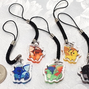 May include: Four colorful dragon phone charms with black cords. The dragons are orange, yellow, green, and black.