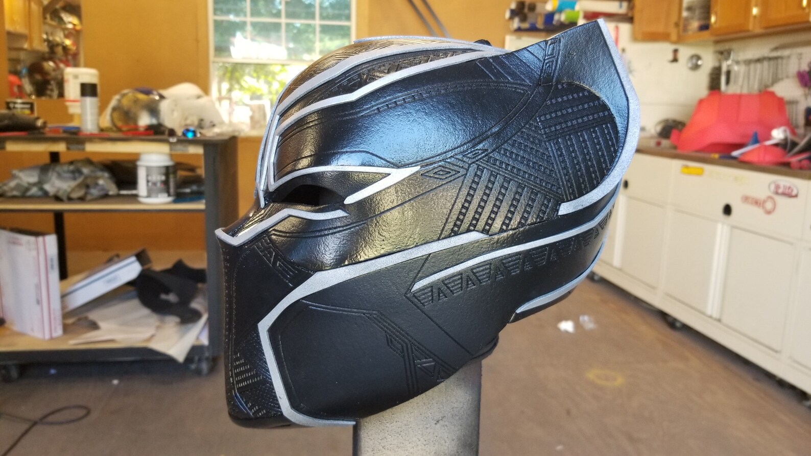 black panther holding helmet