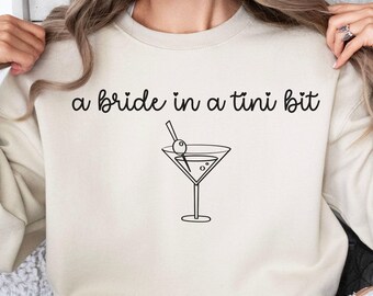 a bride in a tiny bit martini graphic Sweatshirt | bachelorette bridal party