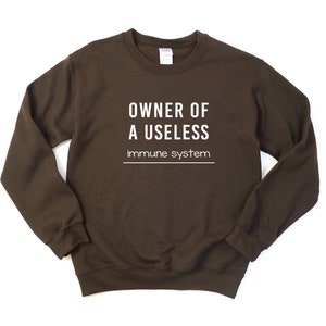 Owner Of A Useless Immune System Crewneck Sweatshirt, Autoimmune Disease Awareness, Primary Immunodeficiency Syndrome, Lupus Awareness
