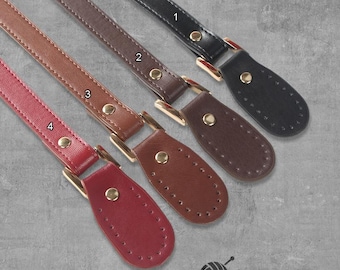 May include: Four leather straps with gold metal hardware and stitching. The straps are in different colors: black, brown, red, and tan. The straps are labeled with numbers 1 through 4.