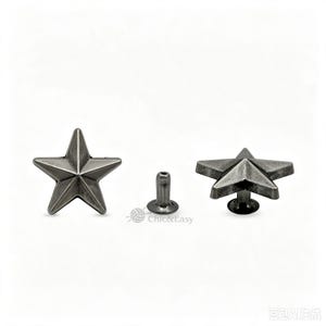 May include: A set of three star-shaped metal rivets with a dark, weathered silver finish. The components include a front star piece, a central post, and a side view of the assembled star rivet. The text Chic&Easy is visible in the centre.