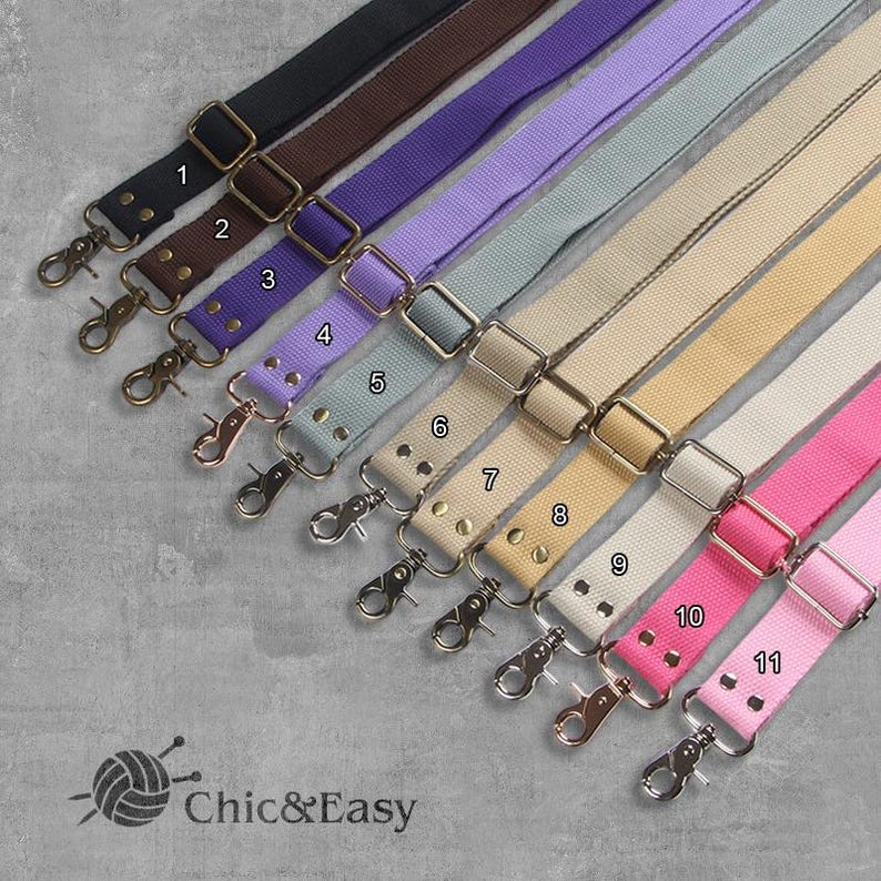 May include: Eleven different colors of adjustable straps with metal hardware and clasps. The straps are made of a woven fabric and have a variety of colors, including black, brown, purple, lavender, light blue, beige, cream, pink, and white.