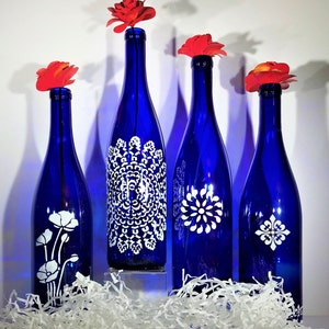 Elegant and unique, blue and white hand painted bottles instantly add style and class to any room or occasion (set of 4)