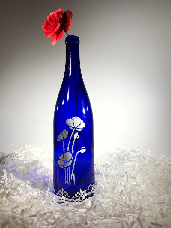 Elegant and unique, blue and white hand painted wine bottle instantly adds  style and class to any room or occasion (multiple flowers)