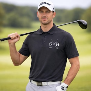 Golfer wearing our personalised polo shirt in Black.