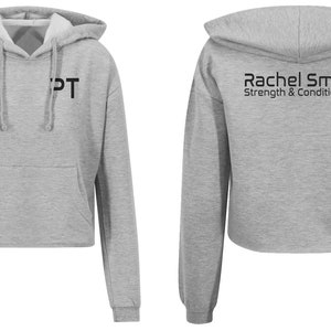 May include: Gray cropped hoodie with a black "PT" logo on the front and "Rachel Smith Strength & Conditioning" text on the back.