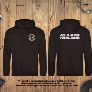 May include: Black hooded sweatshirt with a white logo that says "JOSEF HENDERSON PERSONAL TRAINER" on the back and a green and brown logo that says "FUTURE FITNESS TRAIN FIT NOW" on the front.
