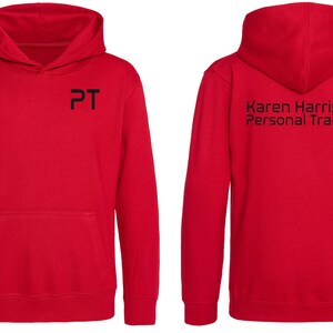 May include: Red hooded sweatshirt with a black "PT" logo on the front and "Karen Harrison Personal Trainer" text on the back.