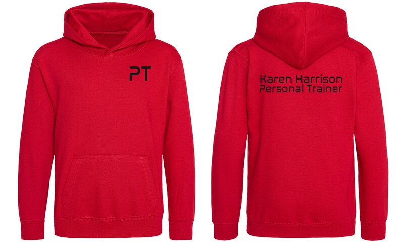 May include: Red hooded sweatshirt with a black "PT" logo on the front and "Karen Harrison Personal Trainer" text on the back.