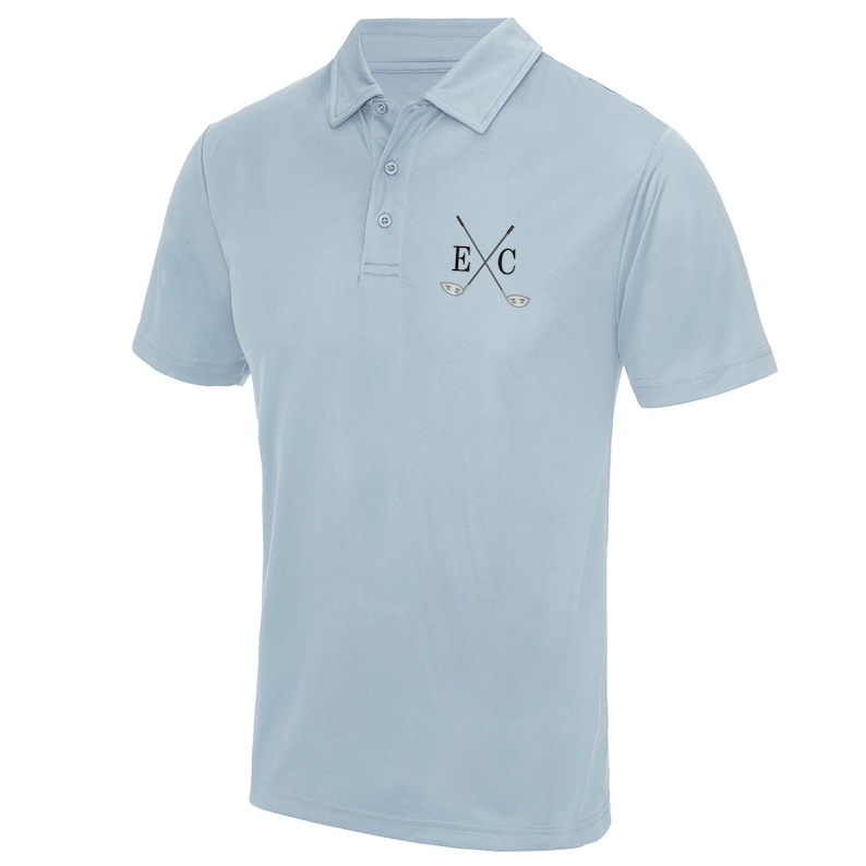 May include: A light blue polo shirt with a small embroidered design of crossed golf clubs and the letters "E" and "C".