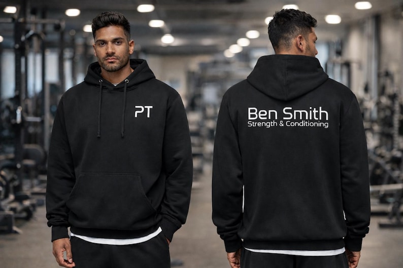 Male Model Wearing Personalised Personal Trainer Men's Hoodie in Black with White Print