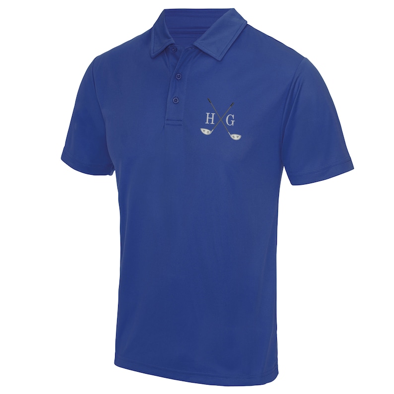 May include: Royal blue short-sleeved polo shirt with a white embroidered logo of crossed golf clubs and the letters "H G".